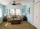 Inviting living room featuring a decorative ceiling fan and comfortable seating area at 5630 Golf Pointe Dr # 108, Sarasota, FL 34243