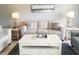 Comfortable living room with a neutral sofa, stylish lamps and coffee table on a blue rug at 5630 Golf Pointe Dr # 108, Sarasota, FL 34243