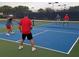 Active pickleball game on a blue and green court, perfect for recreational fun at 5630 Golf Pointe Dr # 108, Sarasota, FL 34243