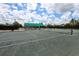 Beautiful tennis court on a sunny day, ready for a friendly match at 5630 Golf Pointe Dr # 108, Sarasota, FL 34243