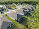 An aerial view of the neighborhood, highlighting the home's desirable location near a pond and lush greenery at 5727 Oak Bridge Ct, Bradenton, FL 34211