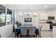 Dining room with chandelier and a large window at 5727 Oak Bridge Ct, Bradenton, FL 34211