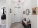 Inviting entryway features a bench, decorative mirror, and artwork, creating a warm welcome at 5727 Oak Bridge Ct, Bradenton, FL 34211