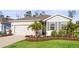 Beautiful single-story home with manicured landscaping and a convenient two-car garage at 5727 Oak Bridge Ct, Bradenton, FL 34211