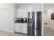 Close up of a kitchen featuring stainless steel refrigerator and granite countertops at 5727 Oak Bridge Ct, Bradenton, FL 34211