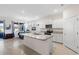 Bright kitchen island features granite countertops and stainless steel appliances with eat-in dining at 5727 Oak Bridge Ct, Bradenton, FL 34211