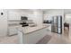 Modern kitchen with granite countertops, stainless steel appliances, and ample cabinet space at 5727 Oak Bridge Ct, Bradenton, FL 34211