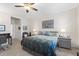 Large main bedroom with a ceiling fan and neutral decor at 5727 Oak Bridge Ct, Bradenton, FL 34211