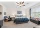 Serene main bedroom with natural light, carpeted floors, and comfortable furnishings at 5727 Oak Bridge Ct, Bradenton, FL 34211