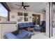 Relaxing covered patio offering ample seating, ceiling fans, and outdoor living space at 5727 Oak Bridge Ct, Bradenton, FL 34211