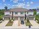 Aerial view of a townhome showcasing its architecture and manicured landscaping at 633 Royal Empress Dr, Ruskin, FL 33570