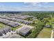 Aerial view showcases community, highlighting architecture, landscaping, and neighborhood layout at 633 Royal Empress Dr, Ruskin, FL 33570