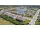 Gorgeous aerial view showcasing the community, lake, and lush green spaces at 633 Royal Empress Dr, Ruskin, FL 33570