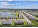 Beautiful aerial view of the community with a scenic lake and well-maintained landscaping at 633 Royal Empress Dr, Ruskin, FL 33570