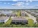 An elevated view of community homes, showcasing the lush grounds with lake at 633 Royal Empress Dr, Ruskin, FL 33570