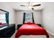 Cozy bedroom featuring neutral walls, dark furnishings, and a ceiling fan at 633 Royal Empress Dr, Ruskin, FL 33570