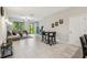 Open-concept living room featuring tile floors, neutral walls, and lots of natural light at 633 Royal Empress Dr, Ruskin, FL 33570