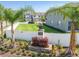 Welcoming Glencove Bay Park entrance with well-manicured lawns and lush landscaping in a lovely neighborhood at 633 Royal Empress Dr, Ruskin, FL 33570