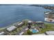 Stunning aerial view of waterfront condos, docks, and the expansive bay, offering a glimpse of serene coastal living at 6500 Flotilla Dr # 125, Holmes Beach, FL 34217