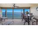 Spacious screened balcony with seating area and stunning views of the water at 6500 Flotilla Dr # 125, Holmes Beach, FL 34217