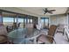 Relaxing outdoor space with comfortable seating, ceiling fan, and serene ambiance at 6500 Flotilla Dr # 125, Holmes Beach, FL 34217