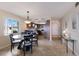 Dining area leading to an open kitchen, complemented by decorative accents and stylish tile flooring at 6500 Flotilla Dr # 125, Holmes Beach, FL 34217