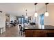 Open-concept living space with a dining area, waterfront views, and tile flooring throughout the main living areas at 6500 Flotilla Dr # 125, Holmes Beach, FL 34217