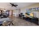 Open living space with a kitchen, dining area, workspace, and living area, all with tile flooring and natural light at 6500 Flotilla Dr # 125, Holmes Beach, FL 34217