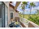 Relaxing balcony with comfortable seating and a lovely view overlooking lush green golf course at 7334 Regina Royale # 74, Sarasota, FL 34238