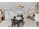 Spacious dining room with tile floors, a fireplace and easy access to the kitchen at 7334 Regina Royale # 74, Sarasota, FL 34238