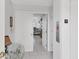 Inviting hallway entrance on the 3rd floor leading into the home at 7334 Regina Royale # 74, Sarasota, FL 34238