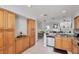The kitchen showcases granite counters, stainless steel appliances, and bright wood cabinetry at 7334 Regina Royale # 74, Sarasota, FL 34238
