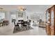 Open-concept living space with tile floors, fireplace and bright neutral color palette at 7334 Regina Royale # 74, Sarasota, FL 34238
