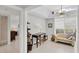 Sunlit office space featuring a desk, shelving, and comfortable seating at 7334 Regina Royale # 74, Sarasota, FL 34238