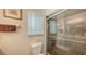 Updated bathroom with a glass-enclosed shower, modern fixtures, and a convenient toilet at 755 Taplow Rd, Venice, FL 34293