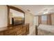 Calm bedroom featuring dresser with a television, natural light, and bright walls at 755 Taplow Rd, Venice, FL 34293