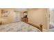 Relaxing bedroom featuring ceiling fan, dresser with a television, and natural light at 755 Taplow Rd, Venice, FL 34293