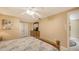 Comfortable bedroom with ceiling fan, beach-themed decor, and closet access at 755 Taplow Rd, Venice, FL 34293
