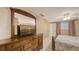 Inviting bedroom features neutral walls, a large dresser with a mirror, and a serene view at 755 Taplow Rd, Venice, FL 34293