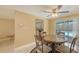 Bright dining area next to the kitchen and leading to the pool at 755 Taplow Rd, Venice, FL 34293