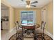 Charming dining area with view of pool and access to kitchen at 755 Taplow Rd, Venice, FL 34293