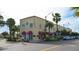 Exterior view of Burgundy Square featuring boutique storefronts and palm trees along a sunny street at 755 Taplow Rd, Venice, FL 34293
