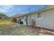 Exterior side view of house and back yard featuring screened pool at 755 Taplow Rd, Venice, FL 34293