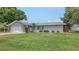 Attractive single-story home with a well-kept lawn, attached garage, and charming curb appeal at 755 Taplow Rd, Venice, FL 34293