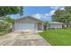 Charming single-story home featuring an attached garage, well-maintained lawn, and freshly painted exterior at 755 Taplow Rd, Venice, FL 34293
