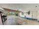 View of the empty garage with open door to the driveway and ample storage space at 755 Taplow Rd, Venice, FL 34293