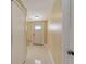 Hallway with bright, natural lighting and access to other parts of the home at 755 Taplow Rd, Venice, FL 34293