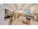 Well-equipped kitchen with a seamless view into the adjacent dining area at 755 Taplow Rd, Venice, FL 34293