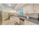 Bright kitchen featuring a stainless steel dishwasher overlooking the dining space at 755 Taplow Rd, Venice, FL 34293
