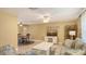 Cozy living room featuring tile floors, stylish furniture, and decorative elements at 755 Taplow Rd, Venice, FL 34293